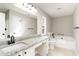 Bathroom featuring granite countertops, a jacuzzi bathtub, and a large mirror at 822 Highway 90, Conway, SC 29526