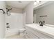 Bathroom featuring a shower-tub combo, a large mirror, and dark fixtures at 822 Highway 90, Conway, SC 29526