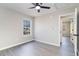 Bedroom featuring gray vinyl flooring, a ceiling fan, and an attached bathroom at 822 Highway 90, Conway, SC 29526