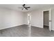 Bedroom featuring gray vinyl flooring, ceiling fan, and an attached bathroom at 822 Highway 90, Conway, SC 29526