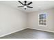 This bedroom has neutral paint, wood-look flooring and a sunny window at 822 Highway 90, Conway, SC 29526