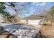 This home boasts a long driveway leading to an attached garage at 822 Highway 90, Conway, SC 29526
