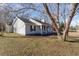 A cozy single-story home is shaded by a large mature tree at 822 Highway 90, Conway, SC 29526