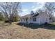 Charming single-story home with a covered porch, black shutters, and a well-maintained yard at 822 Highway 90, Conway, SC 29526