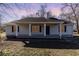 This home has a cozy covered front porch with columns and updated exterior paint at 822 Highway 90, Conway, SC 29526