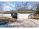 This home features an attached two-car garage and a sliding glass door at 822 Highway 90, Conway, SC 29526