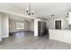 Open-concept kitchen offers lots of natural light, stainless steel appliances, and luxury vinyl floors at 822 Highway 90, Conway, SC 29526