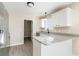 Bright and modern kitchen features granite countertops, stainless steel appliances, and convenient layout at 822 Highway 90, Conway, SC 29526