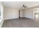 Open-concept living room featuring gray vinyl flooring and an open kitchen at 822 Highway 90, Conway, SC 29526