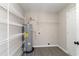 A utility room holds a water heater and storage shelves over wood-look flooring at 822 Highway 90, Conway, SC 29526