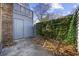 Enclosed backyard with concrete patio, ivy fence, and storage shed at 830 44Th Ave. N # L2, Myrtle Beach, SC 29577