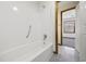 Clean bathroom featuring a tub/shower combination with white tile and wooden doorframe at 830 44Th Ave. N # L2, Myrtle Beach, SC 29577