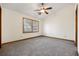 Bright bedroom with gray carpet, ceiling fan, and a large window at 830 44Th Ave. N # L2, Myrtle Beach, SC 29577
