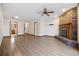 Inviting living room features hardwood floors, a ceiling fan, and a brick fireplace at 830 44Th Ave. N # L2, Myrtle Beach, SC 29577
