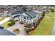 Aerial view of a beautiful traditional home featuring double balconies, mature landscaping, and circular driveway at 898 Bluffview Dr., Myrtle Beach, SC 29579