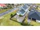 Aerial view of a home with a large driveway and a basketball hoop on a landscaped lawn at 898 Bluffview Dr., Myrtle Beach, SC 29579