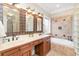 Elegant bathroom with double sinks, decorative tile, a soaking tub, and classic fixtures at 898 Bluffview Dr., Myrtle Beach, SC 29579