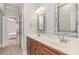 Bathroom vanity featuring double sinks and a large mirror at 898 Bluffview Dr., Myrtle Beach, SC 29579