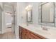 Elegant bathroom with double sink vanity, decorative mirrors and fixtures, and tiled floors at 898 Bluffview Dr., Myrtle Beach, SC 29579