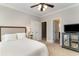 Cozy bedroom features neutral walls, carpet flooring, and double doors leading to closet and bath at 898 Bluffview Dr., Myrtle Beach, SC 29579