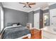 Cozy bedroom featuring hardwood floors, soft lighting, and a comfortable-looking bed with neutral tones at 898 Bluffview Dr., Myrtle Beach, SC 29579