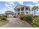Charming two-story home boasts a pillared porch and meticulous landscaping at 898 Bluffview Dr., Myrtle Beach, SC 29579