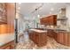 Well-equipped kitchen features an island, stone backsplash, and stainless-steel range hood at 898 Bluffview Dr., Myrtle Beach, SC 29579