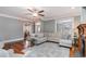 Welcoming living room boasts stylish furniture, a fireplace, rich hardwood floors, and lots of natural light at 898 Bluffview Dr., Myrtle Beach, SC 29579