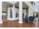Brick patio with comfortable outdoor seating and views of the home's exterior at 898 Bluffview Dr., Myrtle Beach, SC 29579