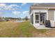 Backyard with a patio, grill, and relaxing views of the pond in a beautiful community at 909 Witherbee Way, Little River, SC 29566