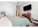 Bedroom features a ceiling fan, television and windows at 909 Witherbee Way, Little River, SC 29566