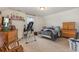 Bright bedroom with dressers and a shelf of trophies at 909 Witherbee Way, Little River, SC 29566