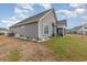 Well-maintained home featuring vinyl siding, a screened-in porch, and a manicured lawn at 909 Witherbee Way, Little River, SC 29566