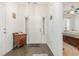 Bright foyer with dark hardwood flooring, leading to the front door and other rooms at 909 Witherbee Way, Little River, SC 29566
