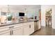 Modern kitchen with granite countertops, stainless steel appliances, and white cabinets at 909 Witherbee Way, Little River, SC 29566