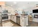 Modern kitchen featuring a central island with seating, stainless appliances, and a bright, open layout at 909 Witherbee Way, Little River, SC 29566