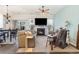 Bright living room with a fireplace, large screen TV, ceiling fan and comfortable seating at 909 Witherbee Way, Little River, SC 29566