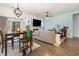 Open-concept living room and dining area with a fireplace and access to an outdoor space at 909 Witherbee Way, Little River, SC 29566