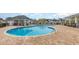 Community pool features a curved design, shallow end, and a paved brick surround at 909 Witherbee Way, Little River, SC 29566