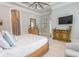 A light and airy bedroom features large windows with plantation shutters and a ceiling fan at 9200 Bellasera Circle, Myrtle Beach, SC 29579