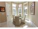 Bright breakfast nook with bay window offering a view of the pool and outdoor area at 9200 Bellasera Circle, Myrtle Beach, SC 29579