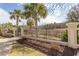 Landscaped front gate with pillars, iron fencing, and a manicured lawn leading to the house at 9200 Bellasera Circle, Myrtle Beach, SC 29579