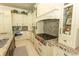 Gourmet kitchen featuring custom cabinets, granite countertops, and high-end stainless steel appliances at 9200 Bellasera Circle, Myrtle Beach, SC 29579