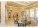 Spacious living room featuring a coffered ceiling, neutral walls, tile floors, and an open floor plan at 9200 Bellasera Circle, Myrtle Beach, SC 29579