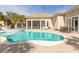 Swimming pool featuring a paved deck, spa, patio furniture and the home's outdoor living space at 9200 Bellasera Circle, Myrtle Beach, SC 29579