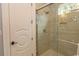 Tiled shower with seamless glass door is enhanced with a built-in shower niche at 9200 Bellasera Circle, Myrtle Beach, SC 29579