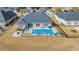 Aerial view of the backyard, featuring a pool and outdoor furniture at 931 Henry James Dr., Myrtle Beach, SC 29579