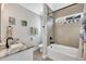 Stylish bathroom featuring a granite vanity, framed mirror, and shower-tub combo at 931 Henry James Dr., Myrtle Beach, SC 29579