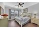Serene bedroom with wood floors, neutral decor and an abundance of natural light at 931 Henry James Dr., Myrtle Beach, SC 29579