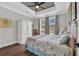 Comfortable bedroom with tray ceiling, hardwood floors and ample natural light at 931 Henry James Dr., Myrtle Beach, SC 29579